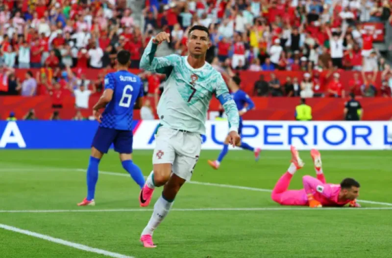 Cristiano Ronaldo dari Portugal merayakan gol yang kemudian dianulir