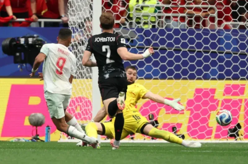Soufiane Rahimi dari Maroko mencetak gol ketiga mereka